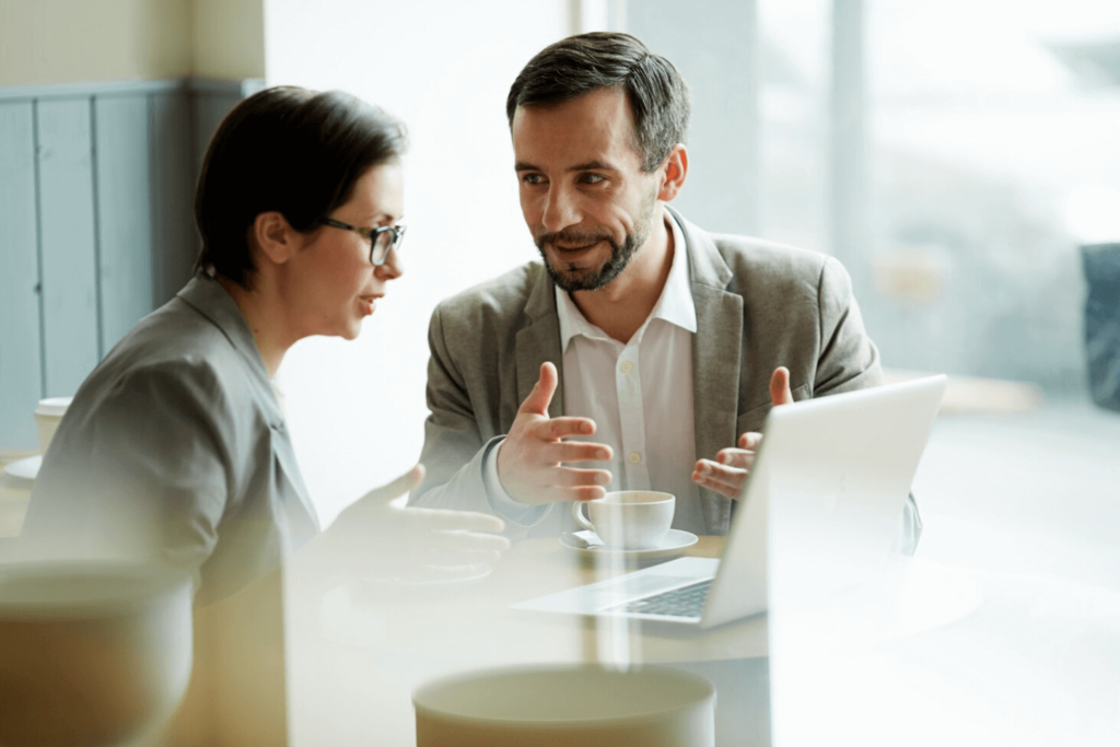 Photo of two business people talking