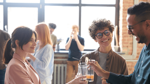 A photo of colleagues socilizing symbolizing happiness at work