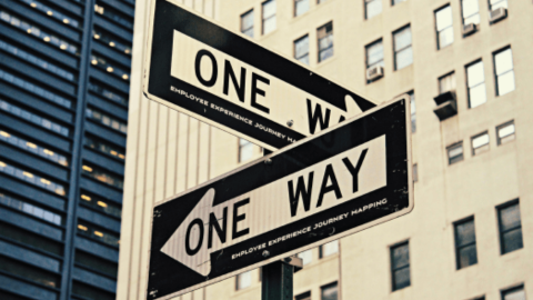 A road sign featuring employee journey mapping