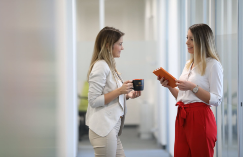 Two colleagues from UBConnect company chatting