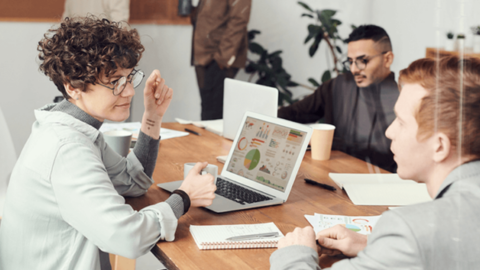 Business meeting of three coworkers, representing the discussion about employee turnover