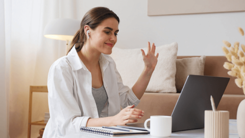 Woman having an online meeting and receiving a positive feedback