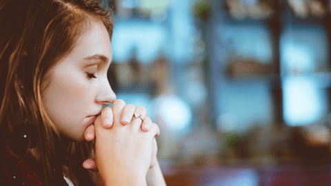 A woman showing signs of being unhappy at work