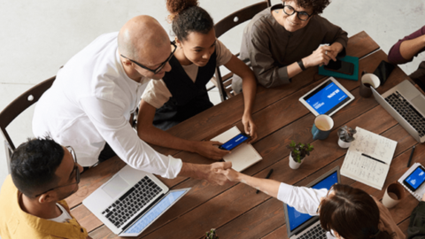 Colleagues in a meeting featuring teamwork