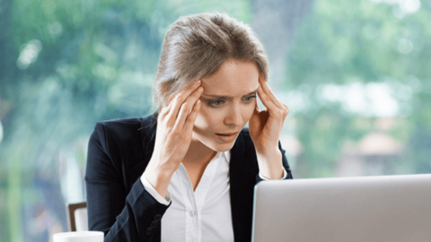 The worried woman looking at her laptop, reflects how employees feel before they decide to quit