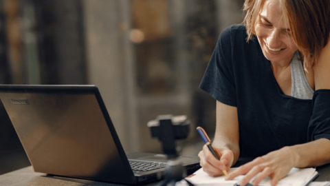 Photo of a woman passionately working on her task