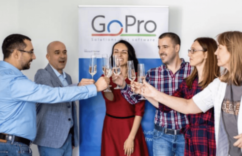 The GoPro team is celebrating with champagne after overcoming challenges thanks to the HeartCount software