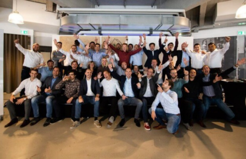 Employees of Bizzomate looking satisfied and cheerful after the implementation of employee experience software