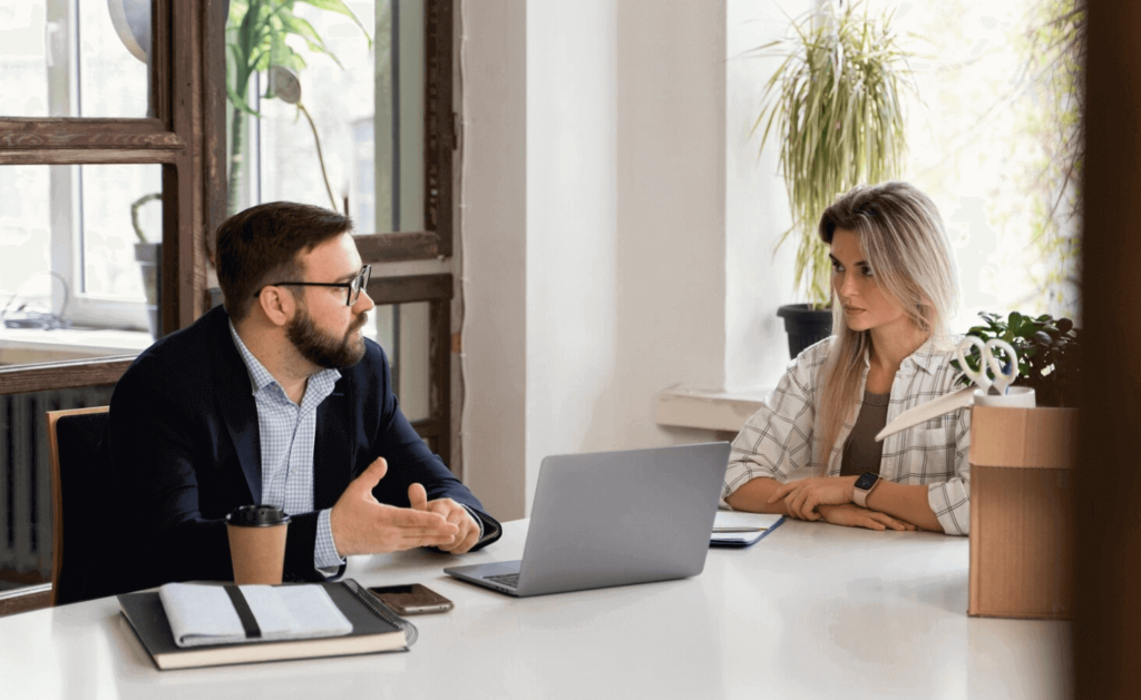 Two employees having one-on-one meeting