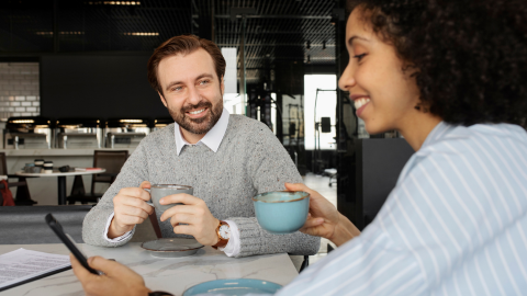 Man and woman having stay conversation over a coffee