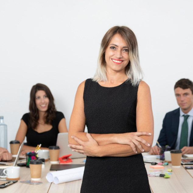 group of men and women posing in the office