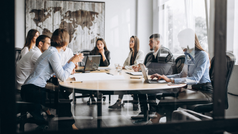 Employee during a business meeting discussing strategic human capital management