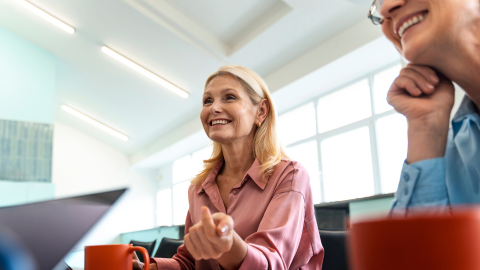 Employee laughing symbolizing the importance of employee benefits