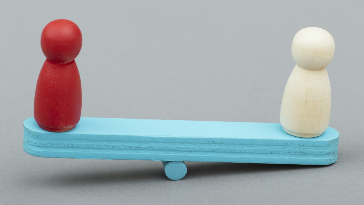 Lattice vs Leapsome comparison shown as two figures balanced on a scale, representing employee engagement trade-offs.