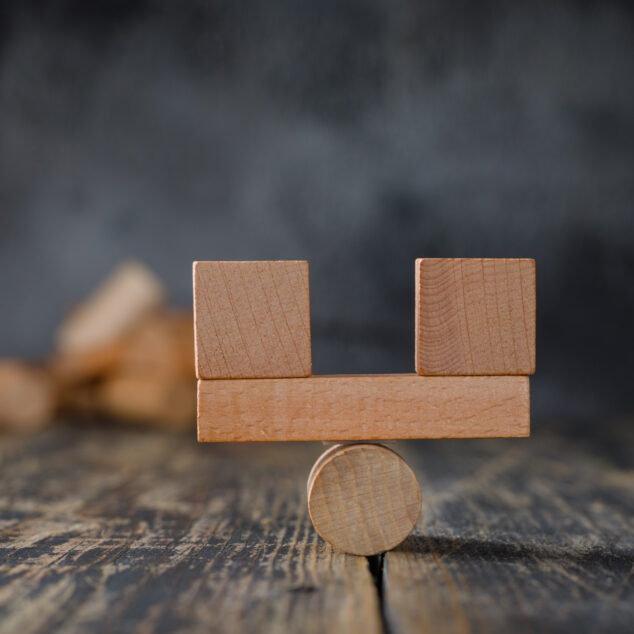Balanced wooden blocks on a pivot symbolizing 15Five vs Workleap comparison in employee engagement software.
