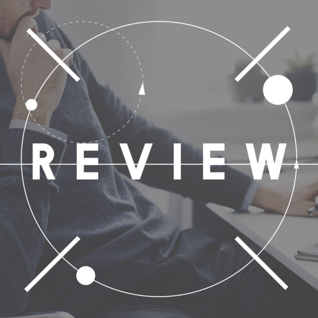 15Five review showing an HR professional evaluating performance management software at a desk