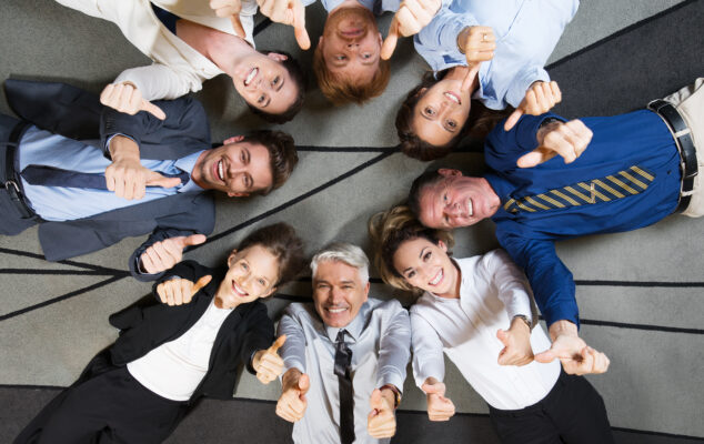 Employees showing appreciation and positivity during a team moment, representing employee appreciation ideas and strong workplace culture.