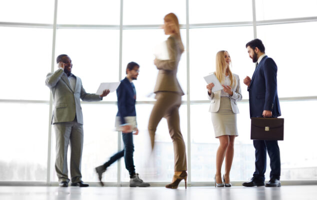 Employee engagement statistics 2025 — diverse team of professionals in a modern office environment